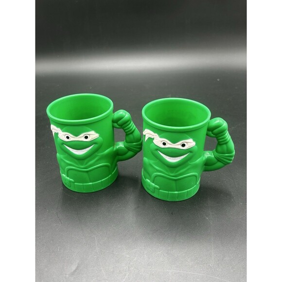 2 VTG 1991 Teenage Mutant Ninja Turtles TMNT Green Plastic Mug Cup Muscle Arm - Picture 1 of 5